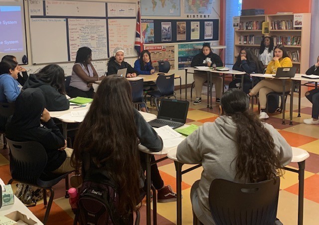 Mercedes Segovia and Jazlyn Gomez hold court during a debate style socratic seminar.